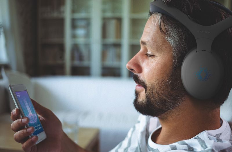 man using sensai headset and app